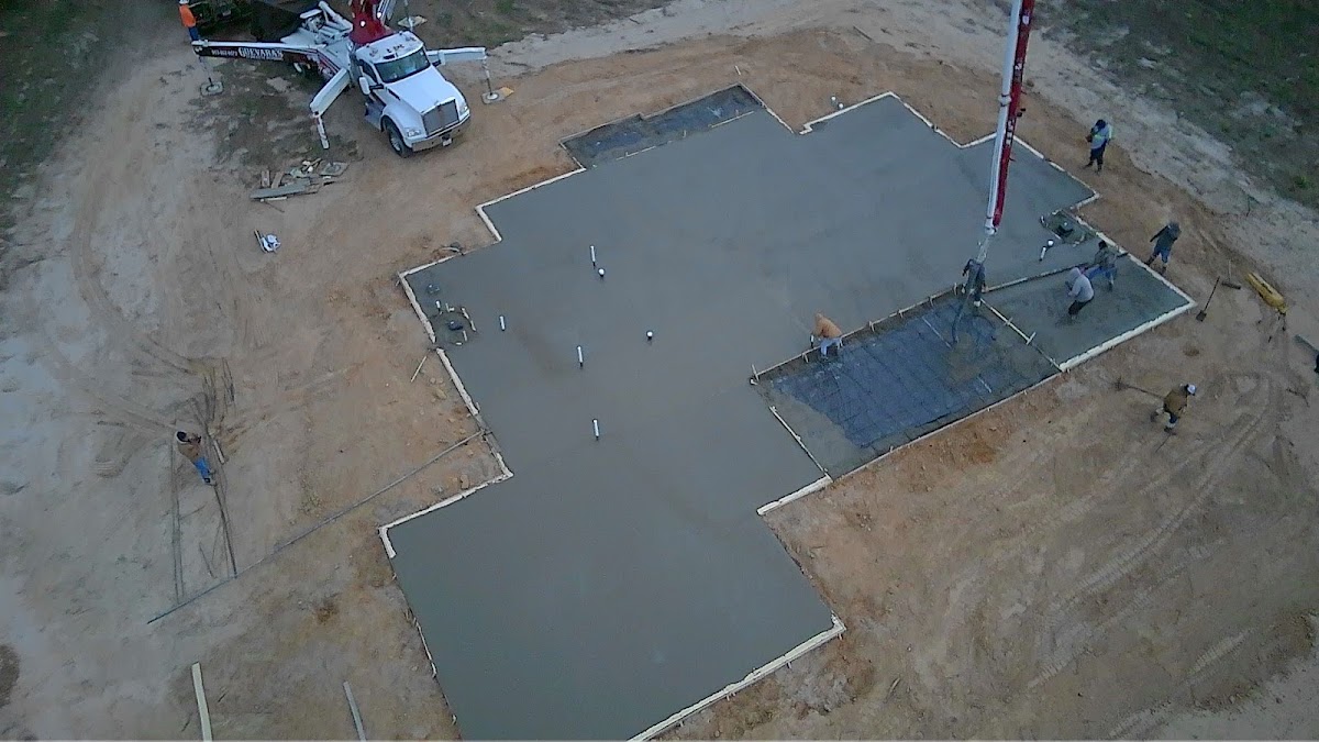 Aerial view of an HBR Concrete crew finishing a large slab pour